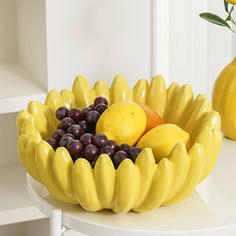 Yellow banana fruit bowl with mixed fruits on marble table lifestyle setting