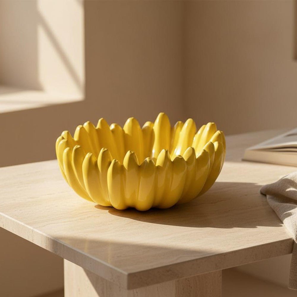 Empty yellow ceramic fruit bowl on wooden table with warm natural lighting