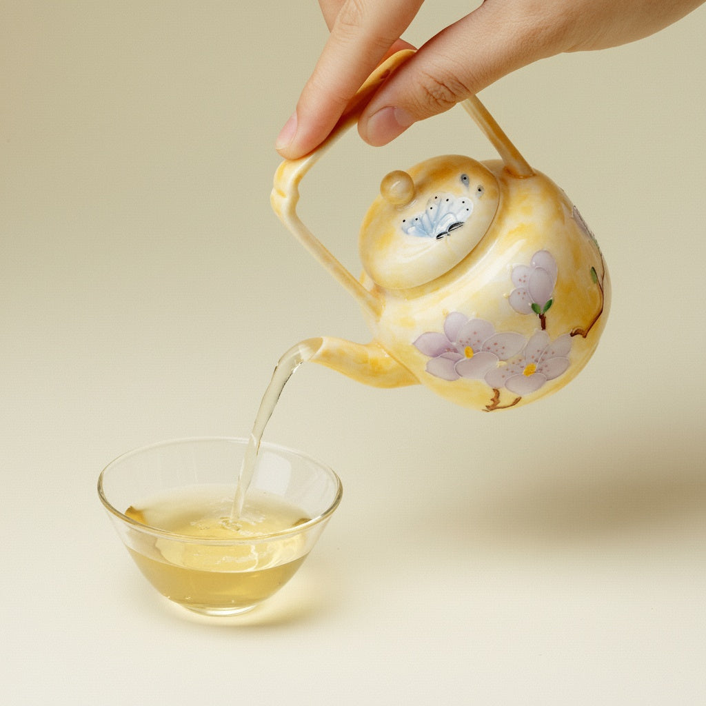 Pouring tea from yellow porcelain teapot